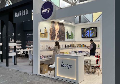Product display area showcasing sports footwear at a booth in IFEMA