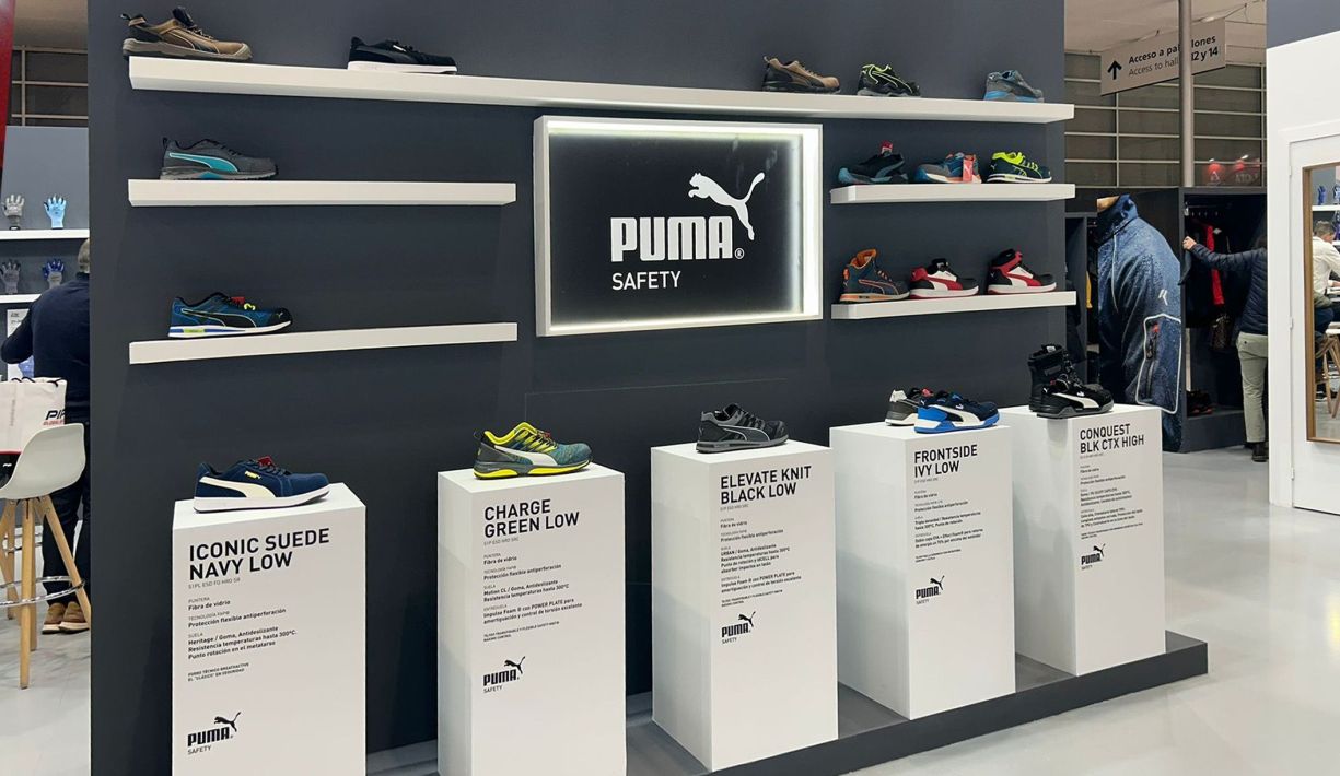 Product display area showcasing sports footwear at a booth in IFEMA