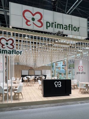 Custom exhibition stand with wooden slats and meeting area at Fruit Attraction Madrid