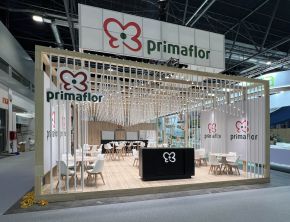 Custom exhibition stand with wooden slats and meeting area at Fruit Attraction Madrid